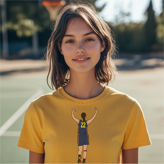 Caitlin Clark-inspired basketball design on a yellow t-shirt, showcasing an illustration of player number 22 celebrating a shot. Ideal for basketball fans and sports enthusiasts. Available on various shirt styles and colors.