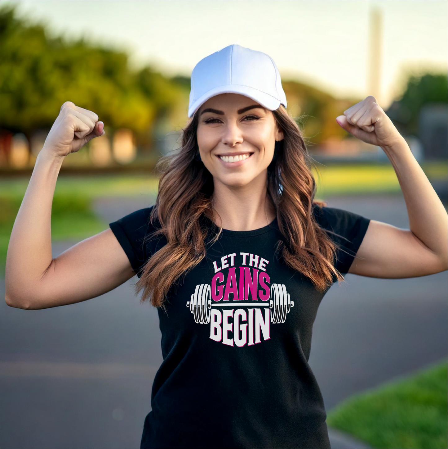 Let the Gains Begin t-shirt design featuring bold text and a barbell graphic, perfect for fitness enthusiasts and gym lovers. Motivational workout apparel suitable for gym-goers aiming to showcase their commitment to fitness and strength. Available in multiple shirt styles and colors.