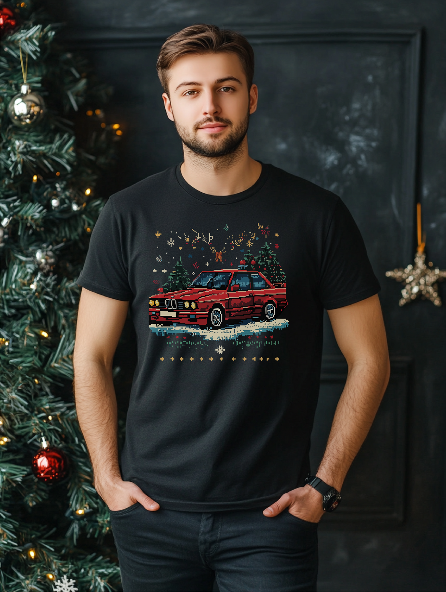 Pixel Perfect Christmas shirt featuring a retro pixel art car with festive holiday details, modeled by a man standing by a Christmas tree.